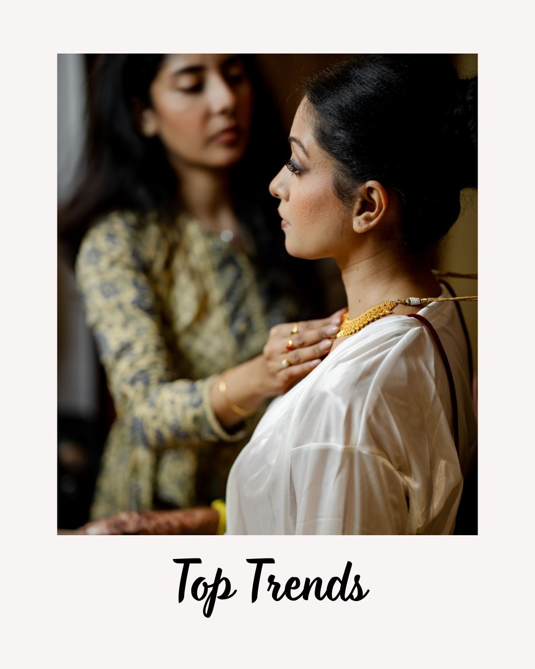 Stylist Helping Bride with Jewelry