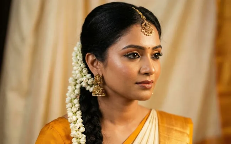 Close-up of South Indian bridal makeup with kohl eyes and temple jewellery for brides