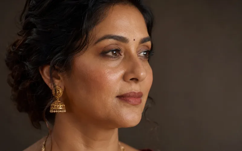 Close-up of mature Indian skin with dewy skin-like bridal makeup base showing natural texture and luminosity