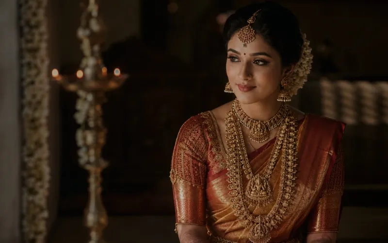 South Indian bride in a silk saree and temple jewellery before sunrise