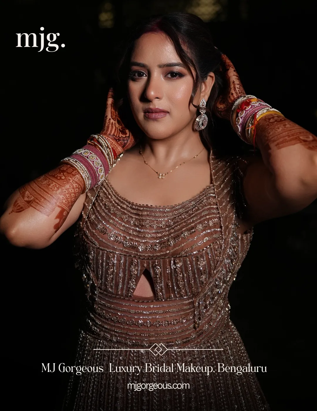 Nikita with defined eye makeup, face-framing hair and embellished attire.